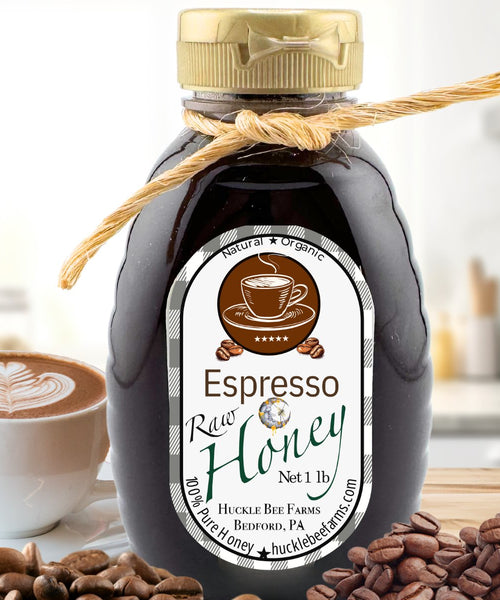 Espresso Raw Honey jar from the Coffee Lover’s Honey Bundle, surrounded by coffee beans and a cappuccino, perfect for coffee and dessert lovers.