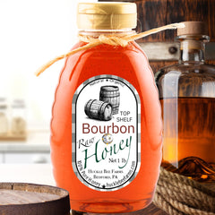 Bourbon Infused Honey: Sweet Southern Charm in Every Bite - Huckle Bee Farms LLC, 1lb raw honey bottle with rustic bourbon barrel label.