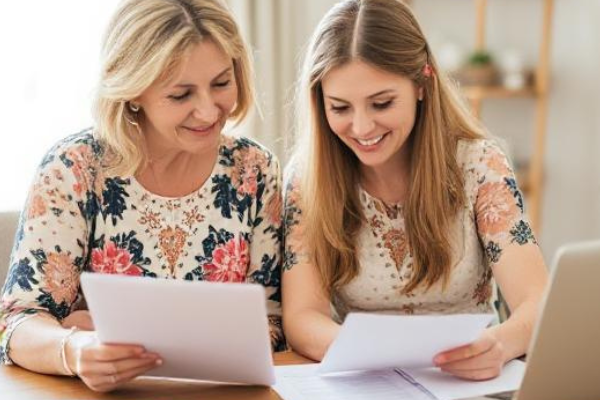 Mom and daughter working on a wedding checklist