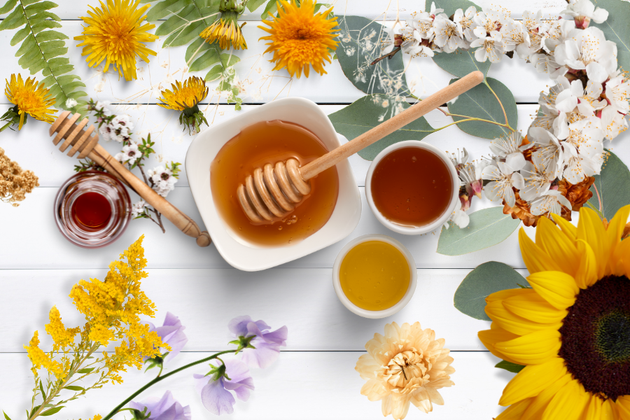 Seasonal honey varieties displayed with spring blossoms, summer sunflowers, autumn leaves, and winter spices