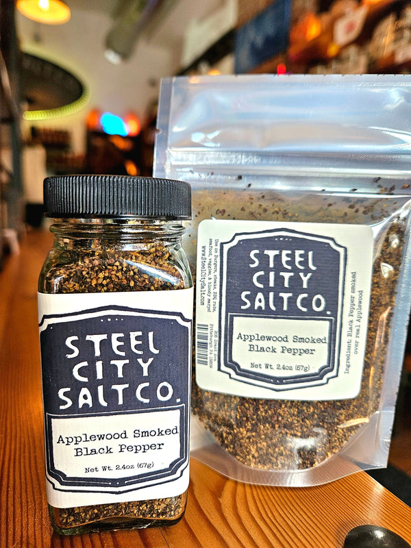 Applewood Smoked Black Pepper by Steel City Salt Co. in jar and resealable pouch. Bold flavor spice for BBQ, steak, seafood, and vegetables.