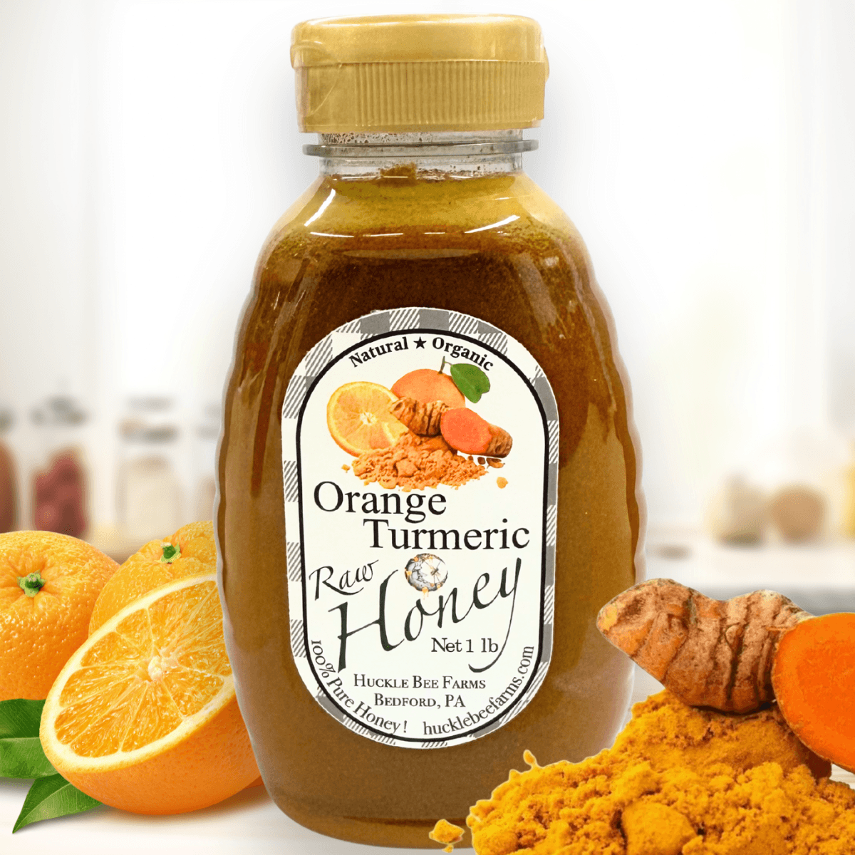 Golden jar of Huckle Bee Farms Orange Turmeric Honey with fresh orange slices and turmeric roots — immune boosting, anti-inflammatory honey blend.