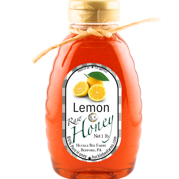 Pure lemon-infused raw honey in a 1lb bottle, showcasing its rich golden color and organic ingredients for a nutritious boost.