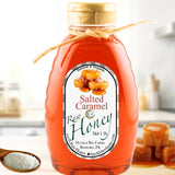 Salted caramel honey in a bottle, golden and rich with sweet caramel and a hint of salt, ideal for drizzling on desserts or stirring into cider.