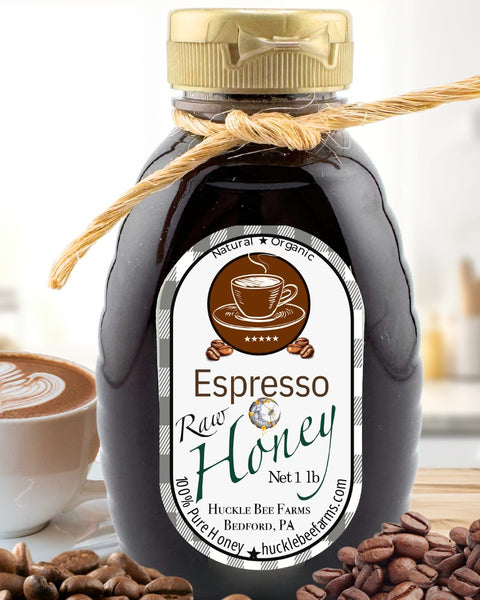 Bottle of Espresso Raw Honey with a label, surrounded by coffee beans and a cup of coffee.