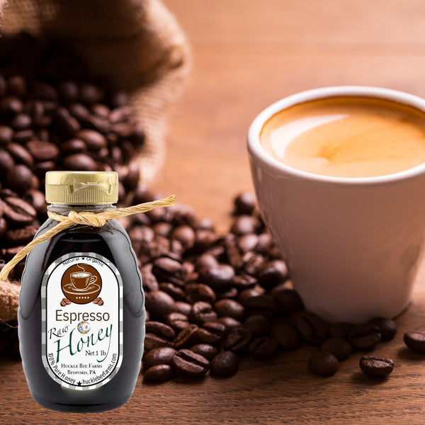 Bottle of Espresso Honey with a cup of coffee and coffee beans on a wooden surface