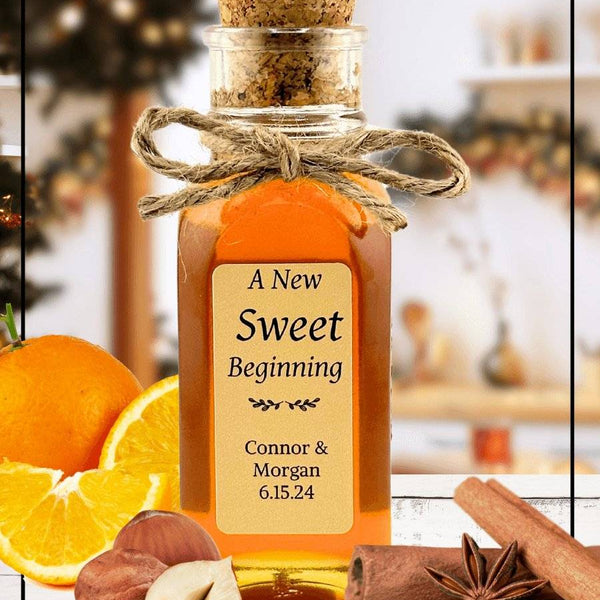Christmas Magic honey blend in a decorative glass jar with a cork lid and twine bow. Infused with cinnamon, orange, and hazelnut flavors, perfect for festive gifting.