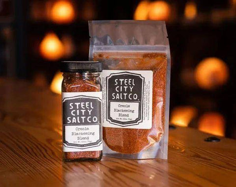 Creole Blackening Blend by Steel City Salt Co. in a glass jar and resealable pouch, available at Huckle Bee Farms LLC for $6.95.