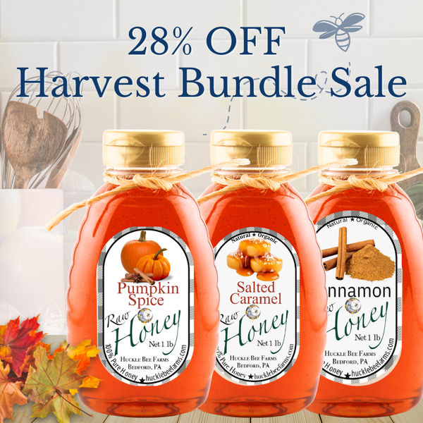 Huckle Bee Farms Harvest Honey Bundle featuring three seasonal infused honeys—pumpkin, salted caramel, and cinnamon—arranged together as a fall gift set.