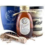 Gift box with raw honey, blue mug, and Earl Grey tea