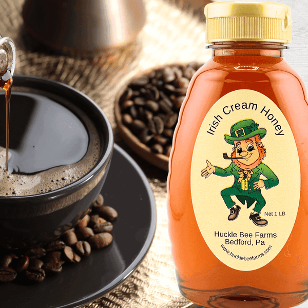 Irish Cream Honey from Huckle Bee Farms LLC in a 1 lb bottle with a leprechaun label. A rich blend of Irish cream and honey, perfect for coffee and desserts.