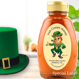 Irish Cream Honey by Huckle Bee Farms LLC in a 1LB bottle with a leprechaun-themed label. Limited-time sale, perfect for coffee and desserts.