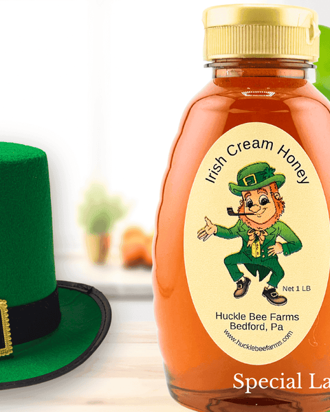 Irish Cream Honey by Huckle Bee Farms LLC in a 1LB bottle with a leprechaun-themed label. Limited-time sale, perfect for coffee and desserts.