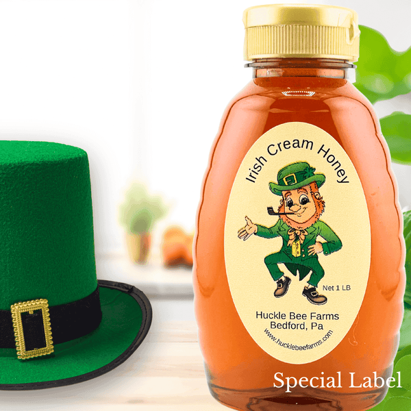 Irish Cream Honey by Huckle Bee Farms LLC in a 1LB bottle with a leprechaun-themed label. Limited-time sale, perfect for coffee and desserts.