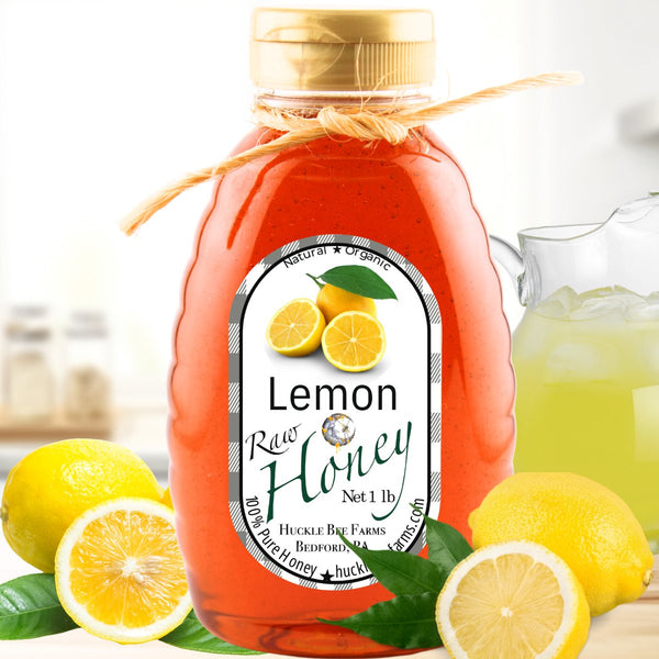 Bright golden lemon honey in a bottle, capturing the zesty citrus notes that pair beautifully with green or black tea.
