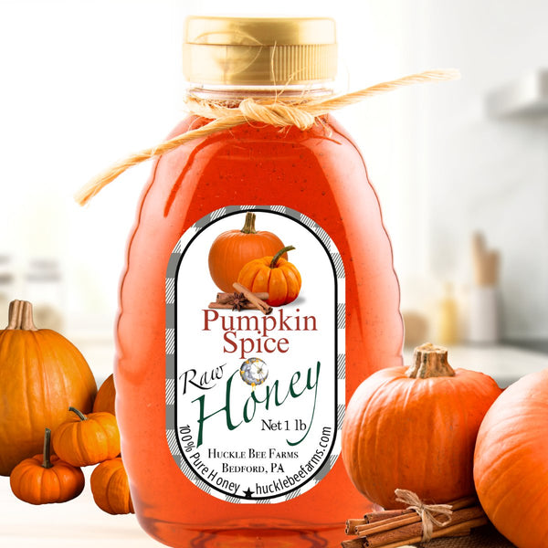 Pumpkin honey in a bottle with warm autumn tones, infused with cozy pumpkin spice flavor, perfect for fall drinks and baked goods.