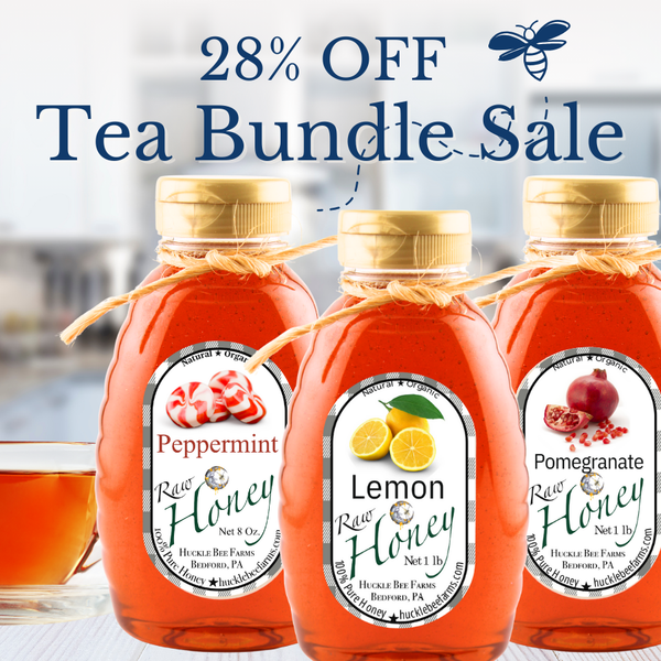 Huckle Bee Farms Tea Bundle featuring three infused honeys—peppermint, lemon, and pomegranate—arranged together as the perfect gift set for tea lovers.