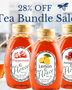 Huckle Bee Farms Tea Bundle featuring three infused honeys—peppermint, lemon, and pomegranate—arranged together as the perfect gift set for tea lovers.