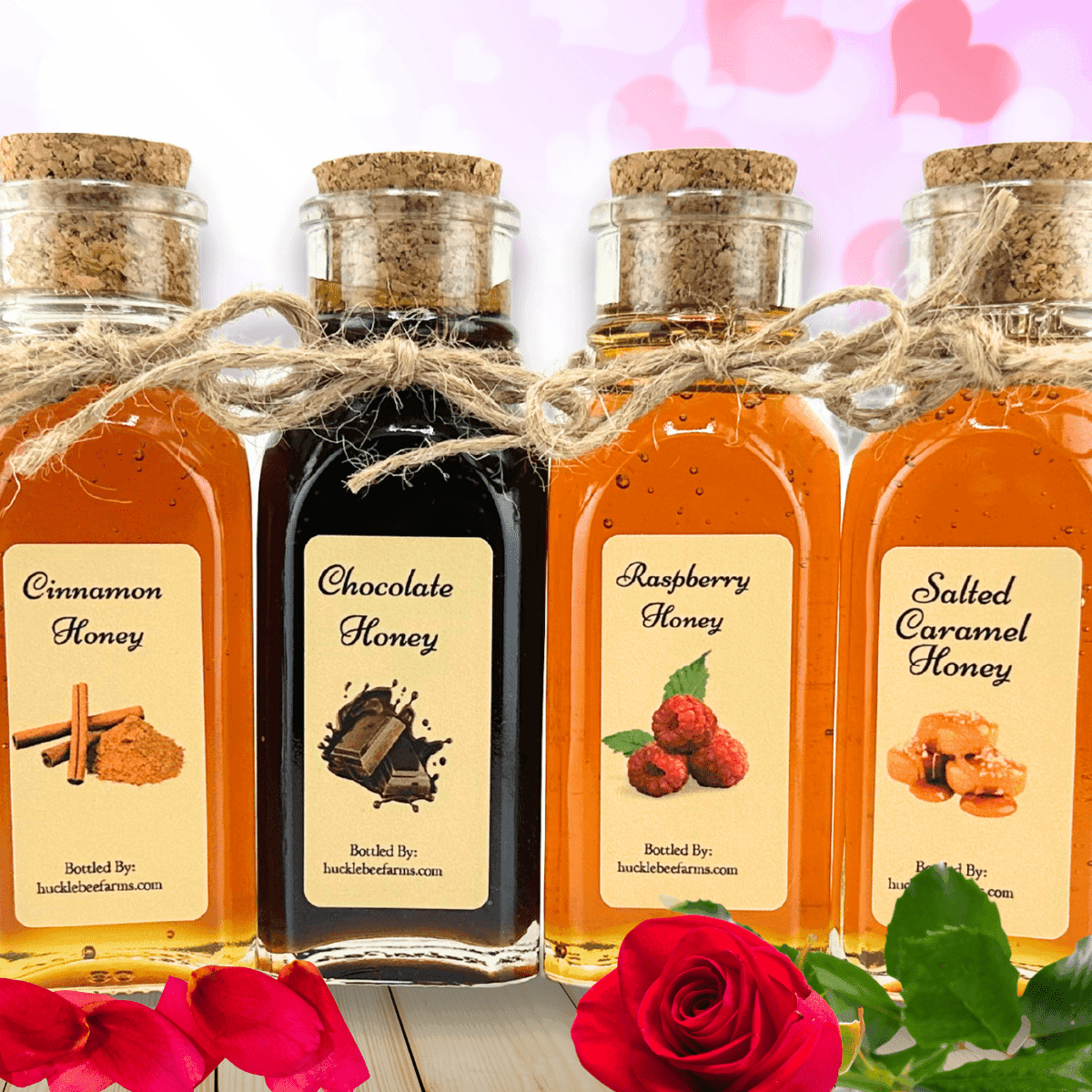 Close-up of four artisanal honey flavors—Cinnamon, Chocolate, Raspberry, and Salted Caramel—beautifully bottled with cork lids and twine.