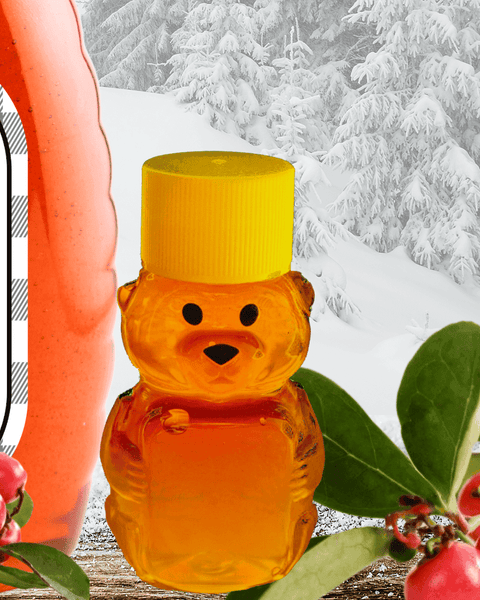 Winter Magic Honey by Huckle Bee Farms LLC in a bear-shaped bottle with a snowy forest background and red berries.